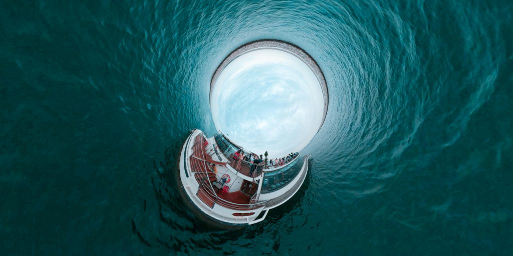 pexels-photo-2251927-2251927 A stunning tiny planet effect image featuring a cruise ship surrounded by ocean water, capturing a unique perspective.